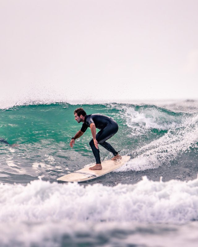 Surfer with a DRIFTER SIC MAUI surfboard