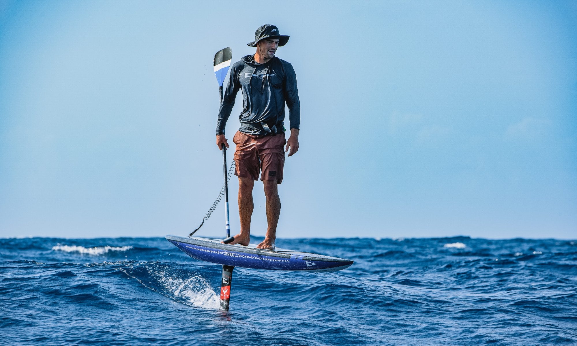Ludovic Teulade on kunalu downwind foilboard in the ocean, athlete of SICMAUI brand