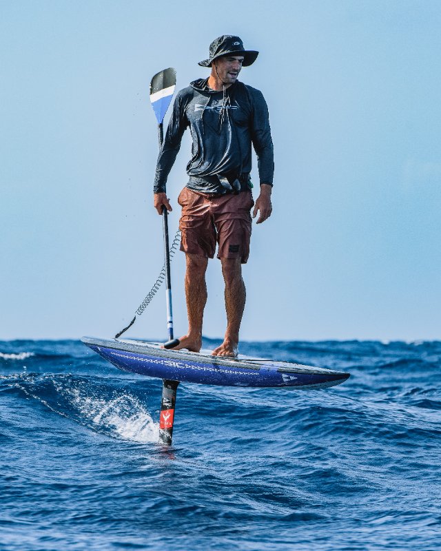 Ludovic Teulade on kunalu downwind foilboard in the ocean, athlete of SICMAUI brand