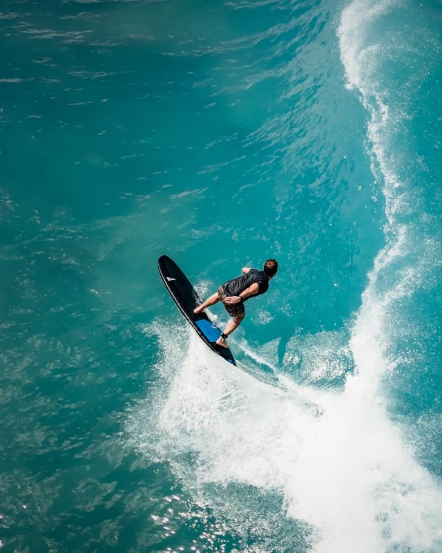 Surfer with a PHANTOM  SIC MAUI Soft surfboard