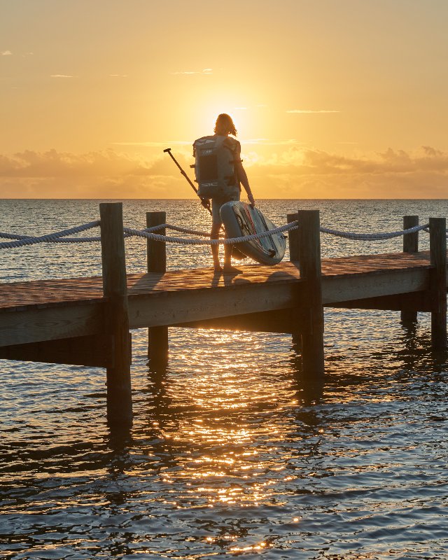 Sunset with a man and his SIC MAUI Sup and paddle